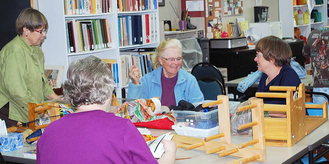 Inkle loom class in session